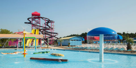 Pool with waterslides in background